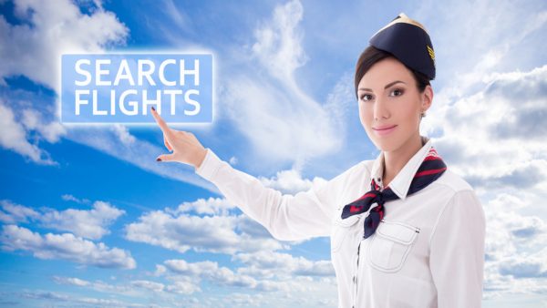 airline flights online, pilot pointing to airline flight board