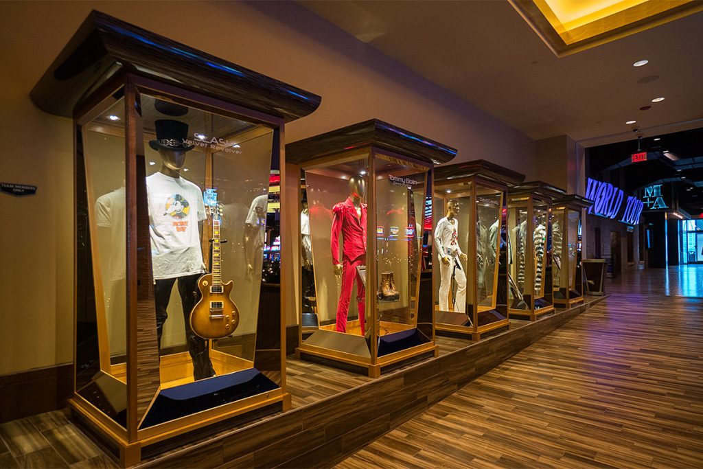 rock stars outfits and guitars in showroom