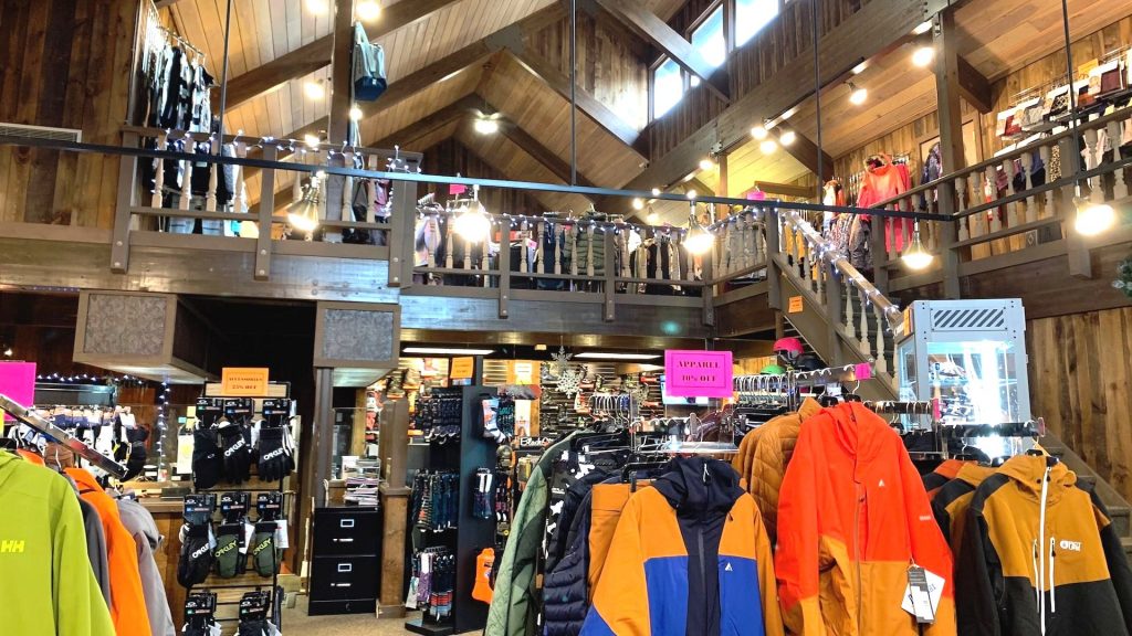 inside a ski shop with skis clothing and accessories