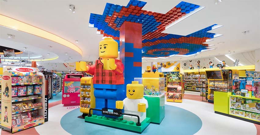 inside toy shop with giant lego at entrance