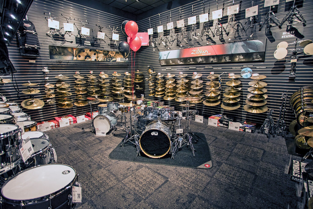 Music shops online, inside music store with large selecti0n of drums